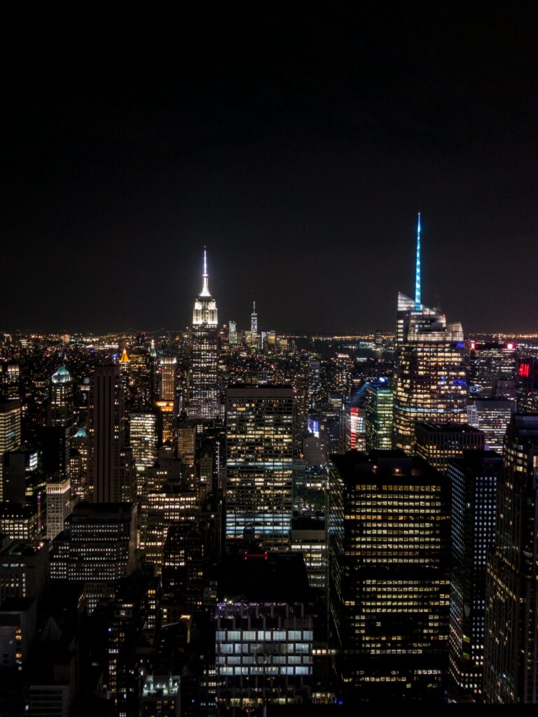 A stunning night cityscape view of New York City featuring the Empire State Building.